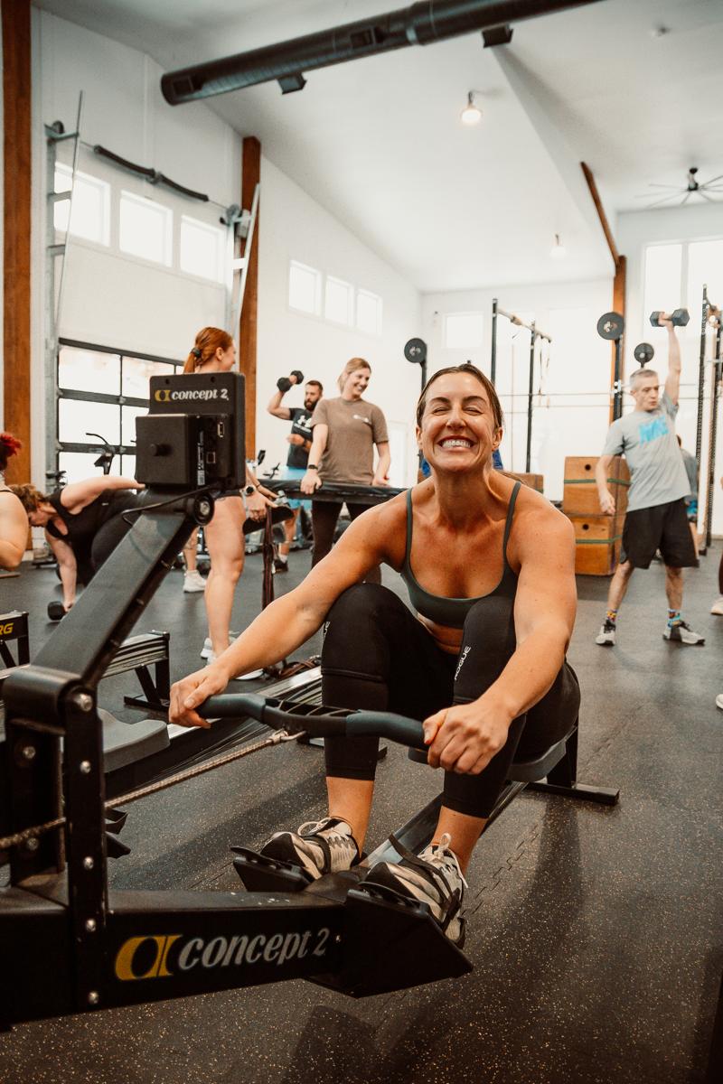 Member laughing on the rower